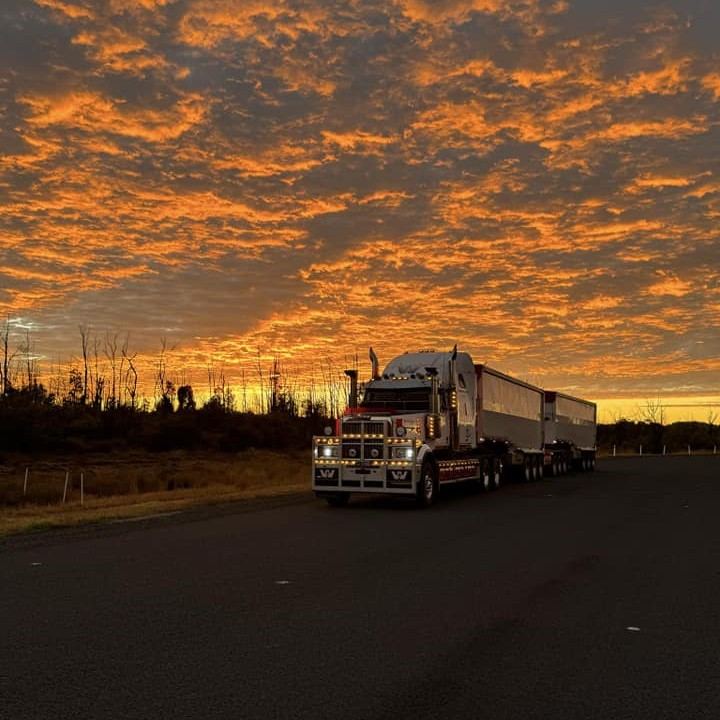 Truck under an orange sunset