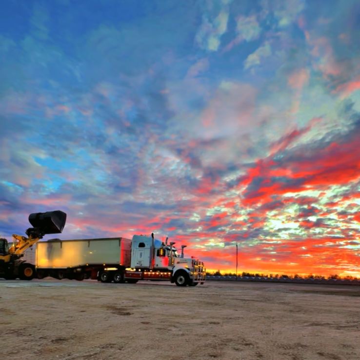 Truck under a red and blue sky